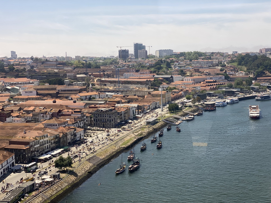 Boats over the Douro river, the Avenida de Diogo Leite street, the Igreja Paroquial de Santa Marinha church and the Gaia Cable Car, viewed from the subway train on the Ponte Luís I bridge