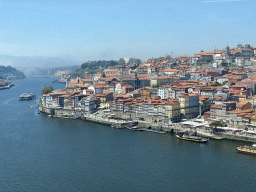 Boats and the Ponte da Arrábida bridge over the Douro river and Porto with the Cais da Estiva and Cais da Ribeira streets, the Igreja Monumento de São Francisco church, the Palácio da Bolsa palace and the Igreja de Nossa Senhora da Vitória church, viewed fom the Miradouro da Ribeira viewing point