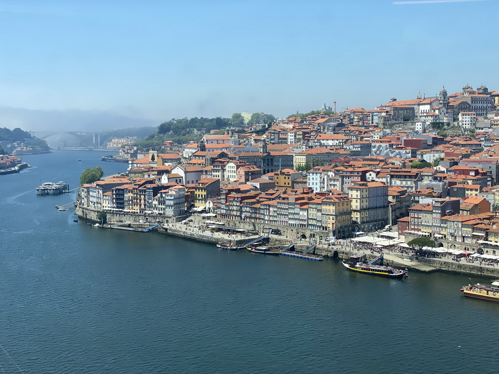 Boats and the Ponte da Arrábida bridge over the Douro river and Porto with the Cais da Estiva and Cais da Ribeira streets, the Igreja Monumento de São Francisco church, the Palácio da Bolsa palace and the Igreja de Nossa Senhora da Vitória church, viewed fom the Miradouro da Ribeira viewing point