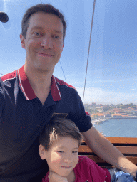 Tim and Max at the Gaia Cable Car, with a view on the Douro river and the Avenida de Ramos Pinto street