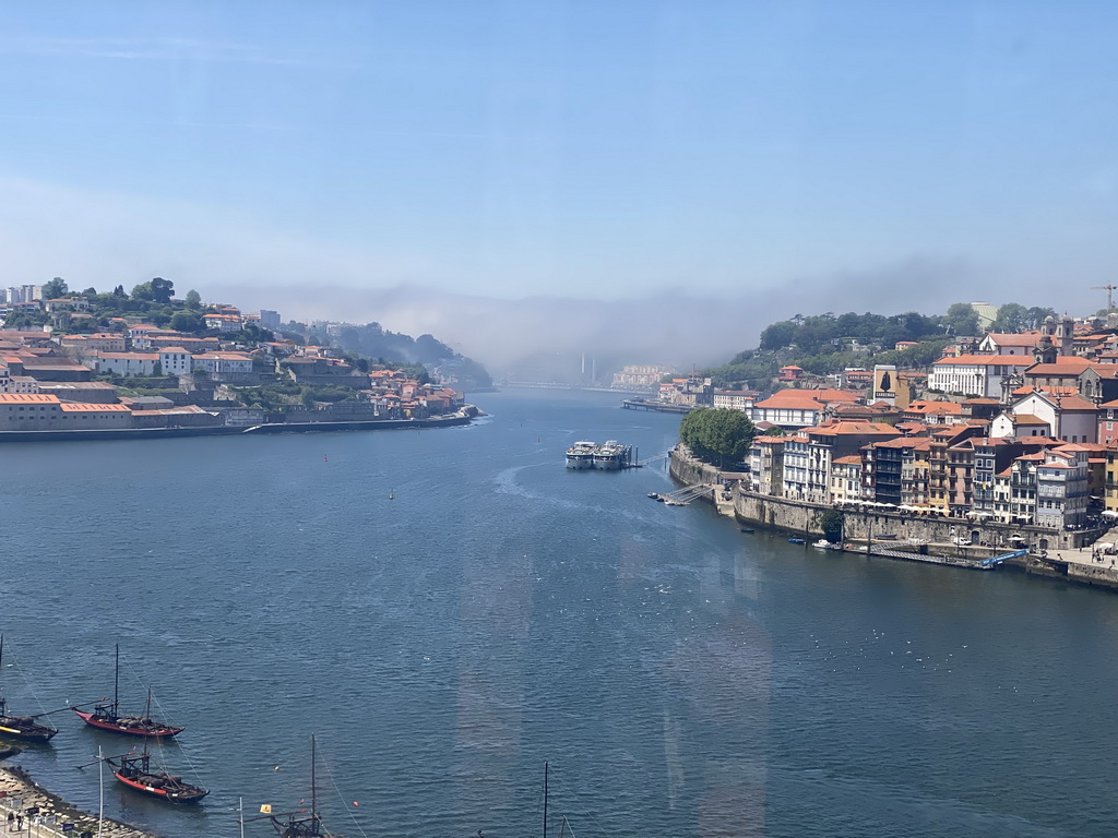 Boats and the Ponte da Arrábida bridge over the Douro river and Porto with the Cais da Estiva street, viewed from the Gaia Cable Car