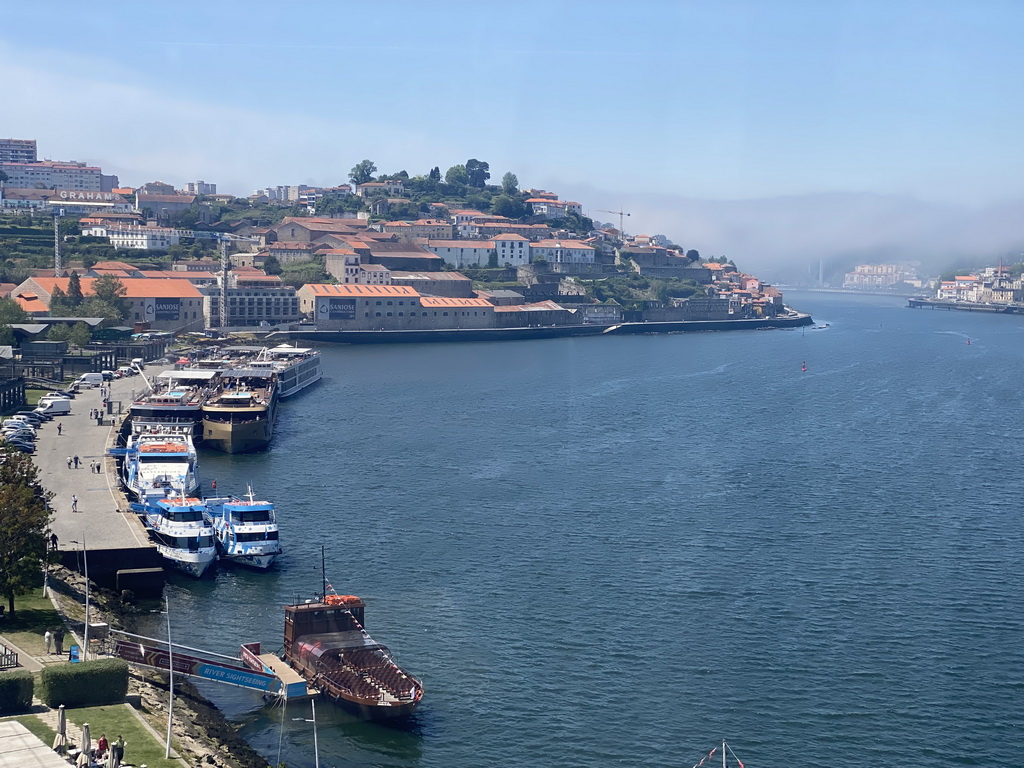 Boats and the Ponte da Arrábida bridge over the Douro river and the Avenida de Ramos Pinto street, viewed from the Gaia Cable Car