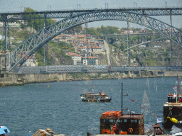 Boats and the Ponte Luís I bridge over the Douro river, viewed from the Sancho Panza restaurant