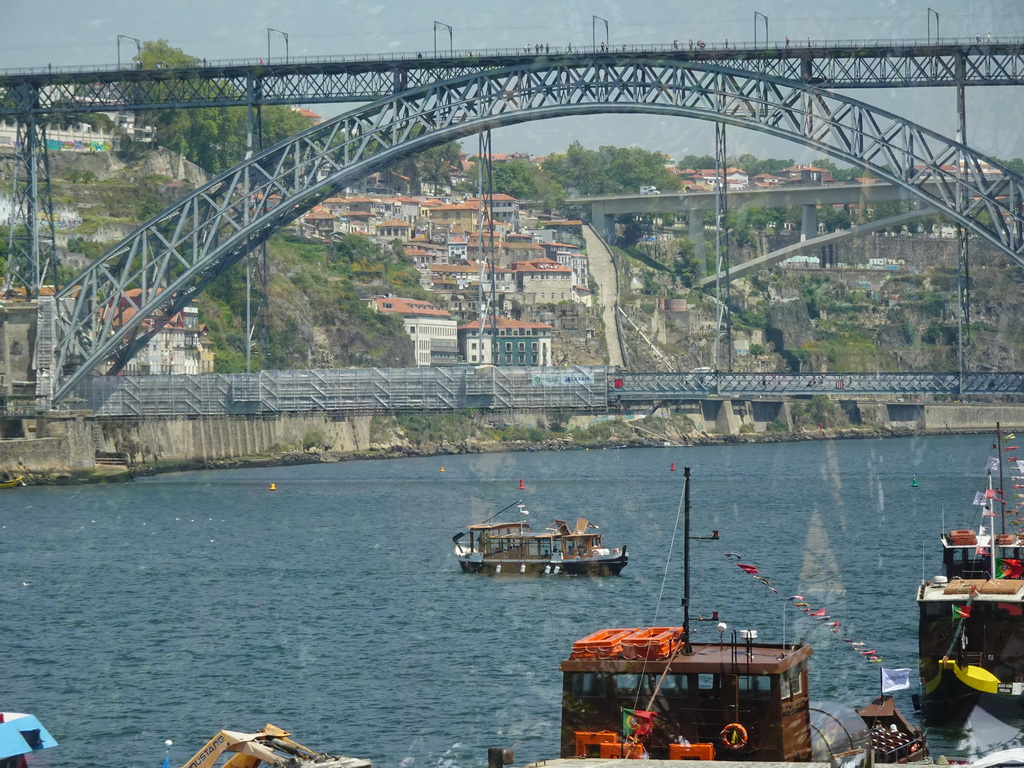 Boats and the Ponte Luís I bridge over the Douro river, viewed from the Sancho Panza restaurant