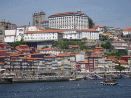 Boats on the Douro river and Porto with the Cais da Ribeira street, the Igreja dos Grilos church, the Porto Cathedral and the Paço Episcopal do Porto palace, viewed from the Sancho Panza restaurant