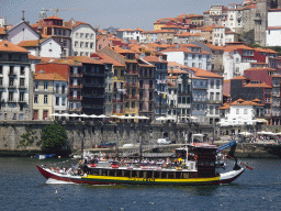 Boat on the Douro river and the Porto with the Cais da Estiva street, viewed from the Sancho Panza restaurant