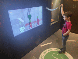 Max playing a cork stopper game at the Planet Cork museum at the WOW Cultural District