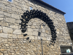 Clock made of rubber tyres on a wall at the Rua de França street