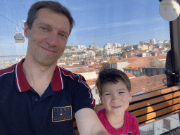 Tim and Max at the Gaia Cable Car, with a view on the Ponte Luís I bridge over the Douro river and the city center