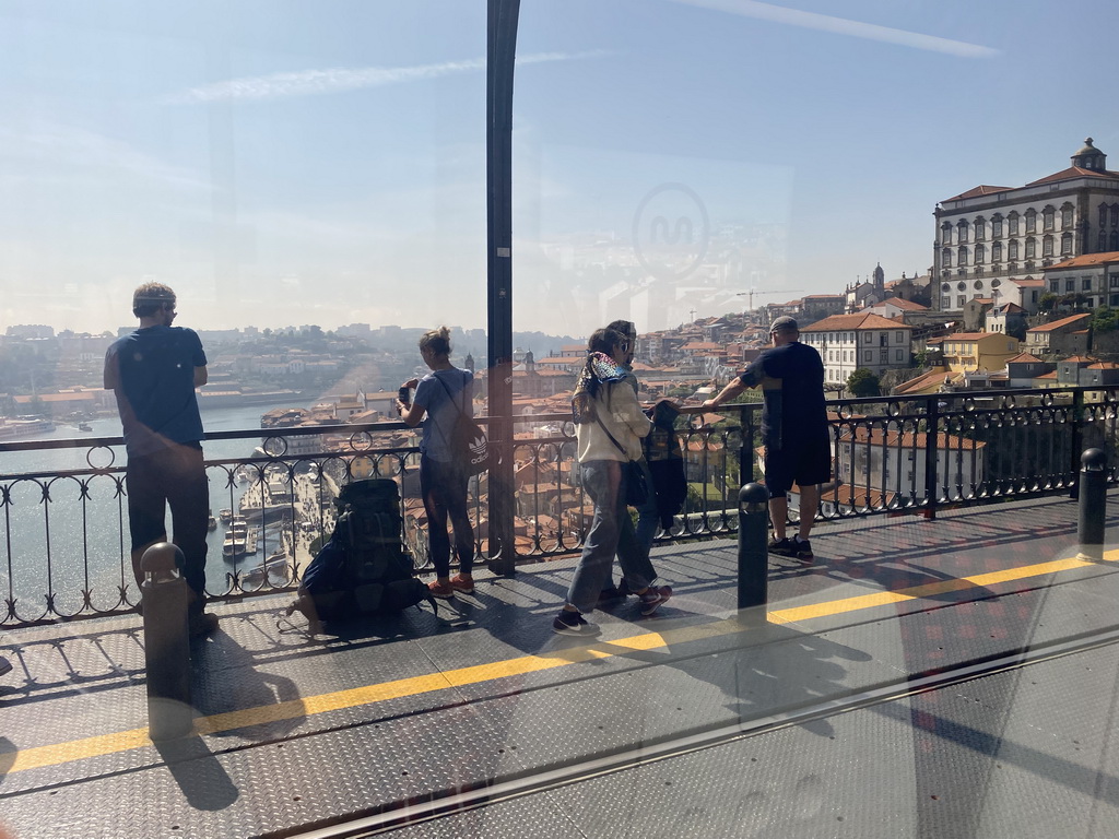 The Douro river and Porto with the Igreja de Nossa Senhora da Vitória church and the Paço Episcopal do Porto palace, viewed from the subway train on the Ponte Luís I bridge