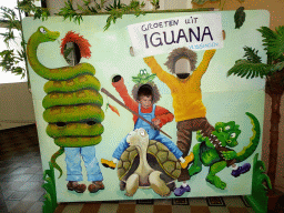 Max with a cardboard at the Iguana Reptile Zoo