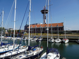 Boats at the Michiel de Ruyter Harbor Marina and the Arsenaal building, viewed from the Ballastkade street