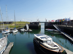 Boats at the Michiel de Ruyter Harbor Marina and the Waterkeering weir, viewed from the Ballastkade street