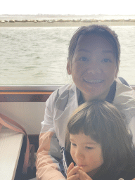 Miaomiao and Max at the Seal Safari boat on the National Park Oosterschelde, with a view on the seals at the Vondelingsplaat sandbank