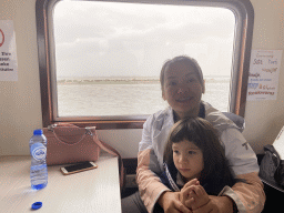 Miaomiao and Max at the Seal Safari boat on the National Park Oosterschelde, with a view on the seals at the Vondelingsplaat sandbank