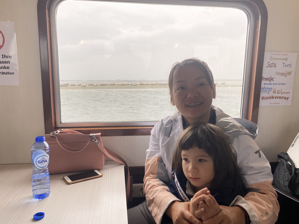 Miaomiao and Max at the Seal Safari boat on the National Park Oosterschelde, with a view on the seals at the Vondelingsplaat sandbank