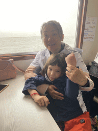 Miaomiao and Max at the Seal Safari boat on the National Park Oosterschelde, with a view on the seals at the Vondelingsplaat sandbank