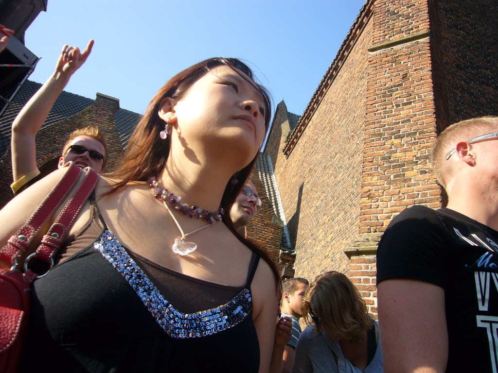 Miaomiao in front of the Grote Kerk church at the Markt square during the Liberation Day festivities