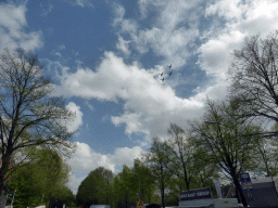 Airplanes flying above the trees, during the Liberation Day festivities