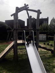 Max on the slide at the playground at the Veerstraat street