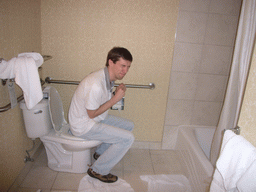 Tim on the toilet of our room in the Best Western Capitol Skyline hotel