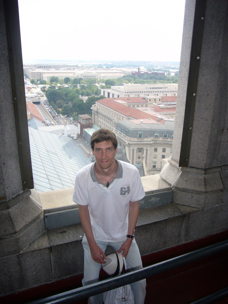 Tim and a view on the Ronald Reagan Building, from the Old Post Office Pavilion