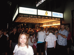 Miaomiao in front of the National Theatre, after the musical `Mamma Mia`, by night