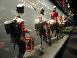 Statues of allied soldiers at the Lower Floor of the Mémorial 1815 museum, with explanation