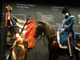 Statues of French soldiers and a horse at the Lower Floor of the Mémorial 1815 museum, with explanation