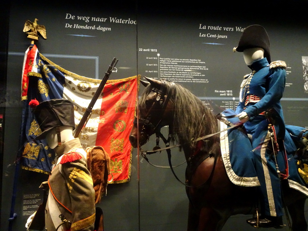 Statues of French soldiers and a horse at the Lower Floor of the Mémorial 1815 museum, with explanation