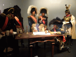 Statues of French officers in the Morning at Napoleon`s Headquarters at the Lower Floor of the Mémorial 1815 museum, with explanation