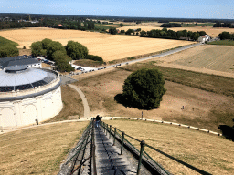The area northeast of the Lion`s Mound with the Route du Lion road, the Panorama of the Battle of Waterloo building and the Le Bivouac de l`Empereur restaurant, viewed from the top