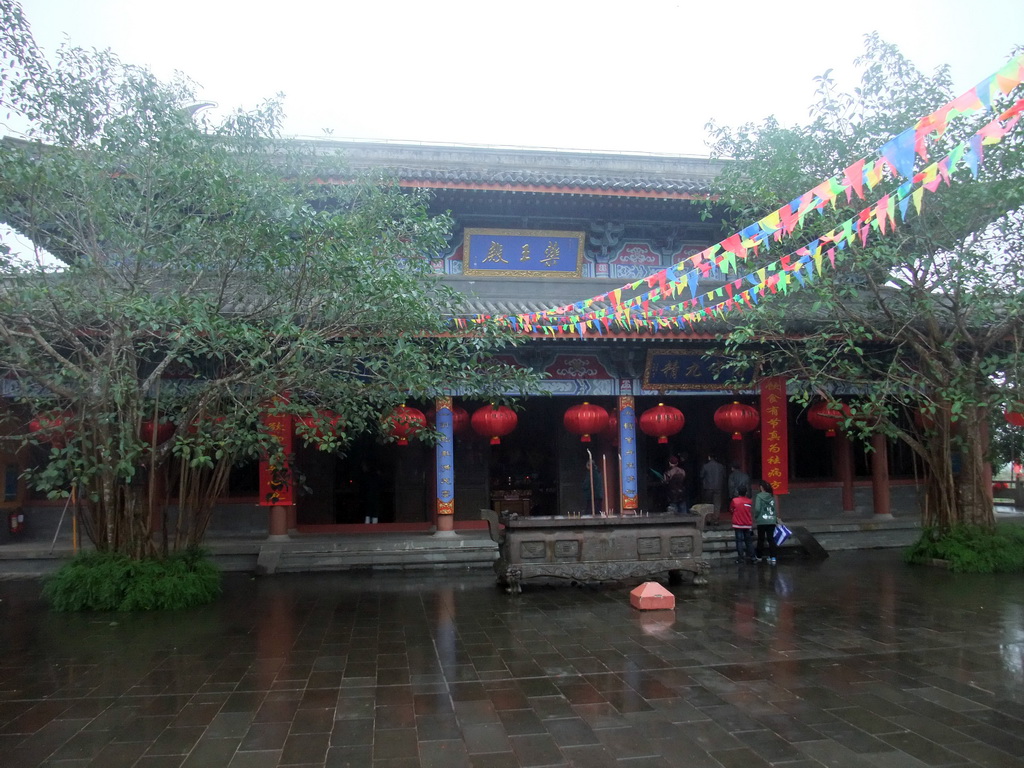 Temple with burning incense at the Yuchan Palace at the Hainan Wenbifeng Taoism Park