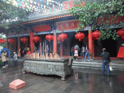 Temple with burning incense at the Yuchan Palace at the Hainan Wenbifeng Taoism Park