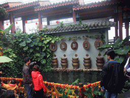 Buddhist bells and pool at the Yuchan Palace at the Hainan Wenbifeng Taoism Park