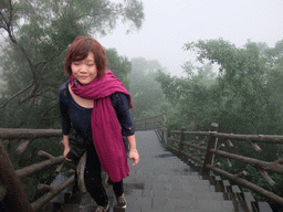 Miaomiao at the staircase to the upper platform of the Yuchan Palace at the Hainan Wenbifeng Taoism Park