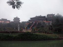 Pool, Buddha statue and the eastern staircase to the Yuchan Palace at the Hainan Wenbifeng Taoism Park