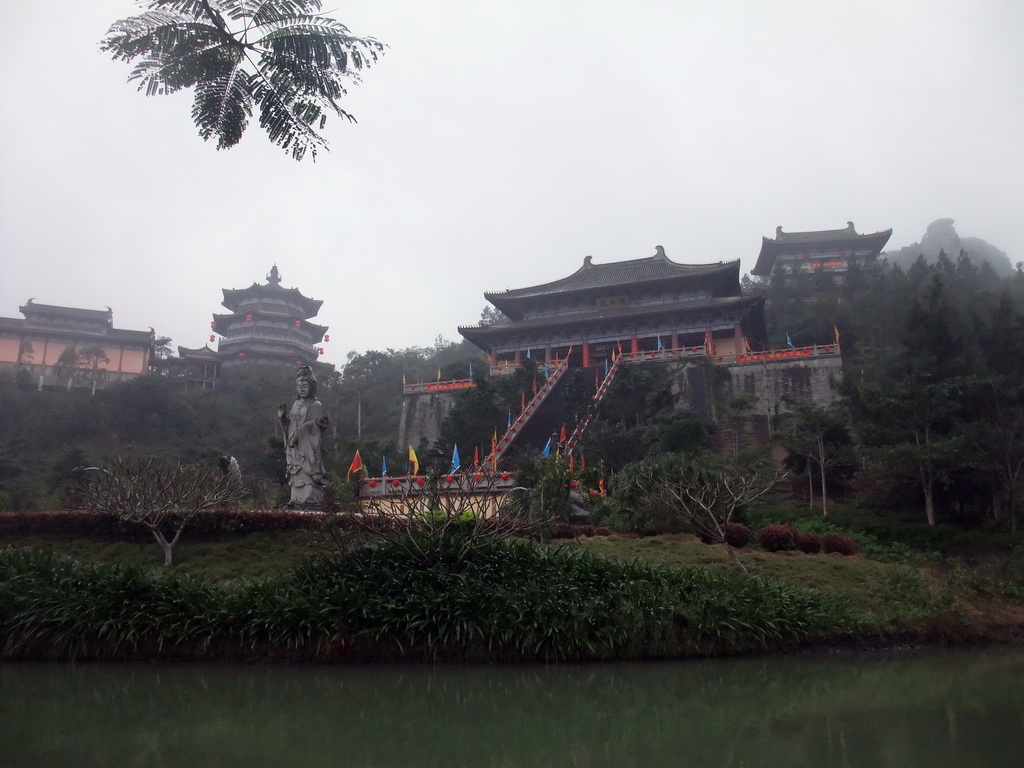 Pool, Buddha statue and the eastern staircase to the Yuchan Palace at the Hainan Wenbifeng Taoism Park