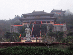 Buddha statue and the eastern staircase to the Yuchan Palace at the Hainan Wenbifeng Taoism Park