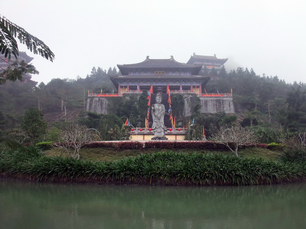 Pool, Buddha statue and the eastern staircase to the Yuchan Palace at the Hainan Wenbifeng Taoism Park