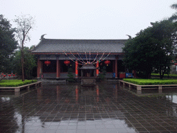 Temple, incense burners and flag at the east side of the Hainan Wenbifeng Taoism Park