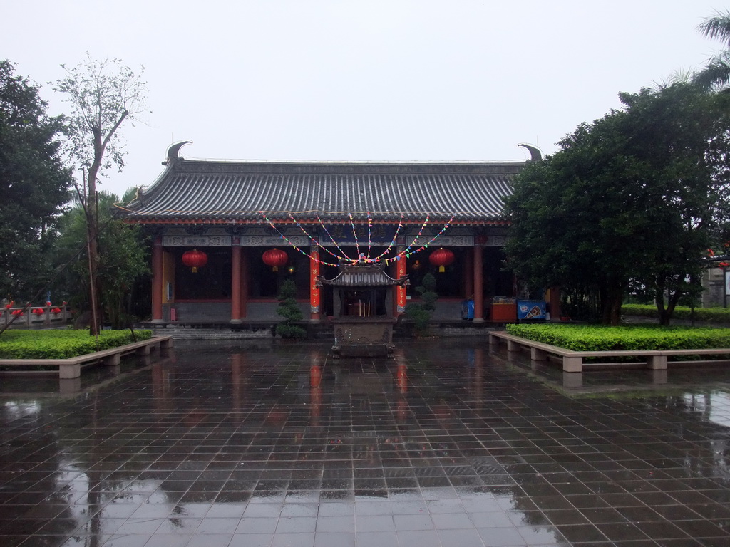 Temple, incense burners and flag at the east side of the Hainan Wenbifeng Taoism Park