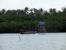 Fishing boat and watch tower at Bamenwan Bay, viewed from the tour boat
