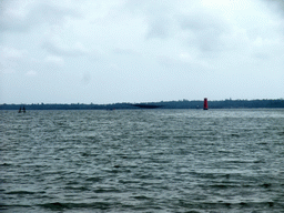 Fishing net and lighthouse at Bamenwan Bay, viewed from the tour boat