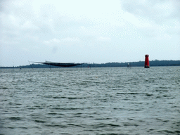 Fishing net and lighthouse at Bamenwan Bay, viewed from the tour boat