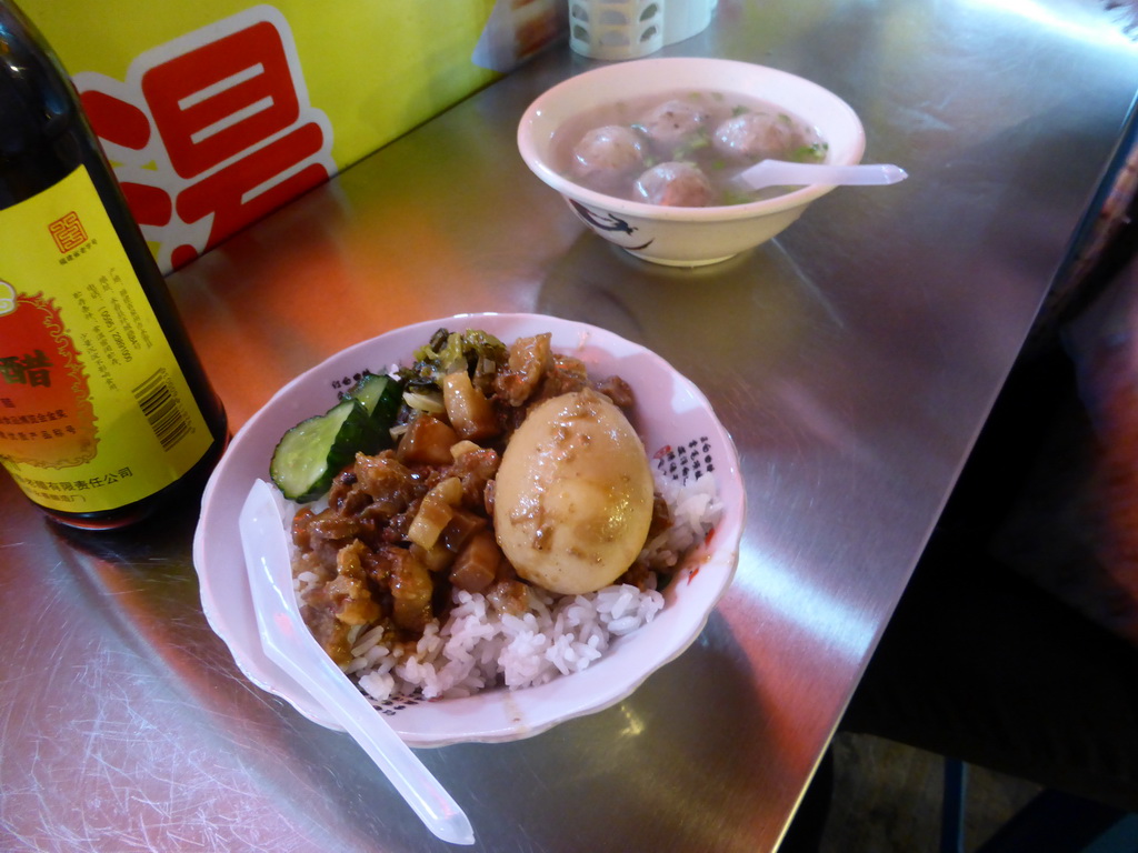 Snack with meat, egg, vegetables and rice at a snack stall at the Taiwan Snack Street at Renhe Road