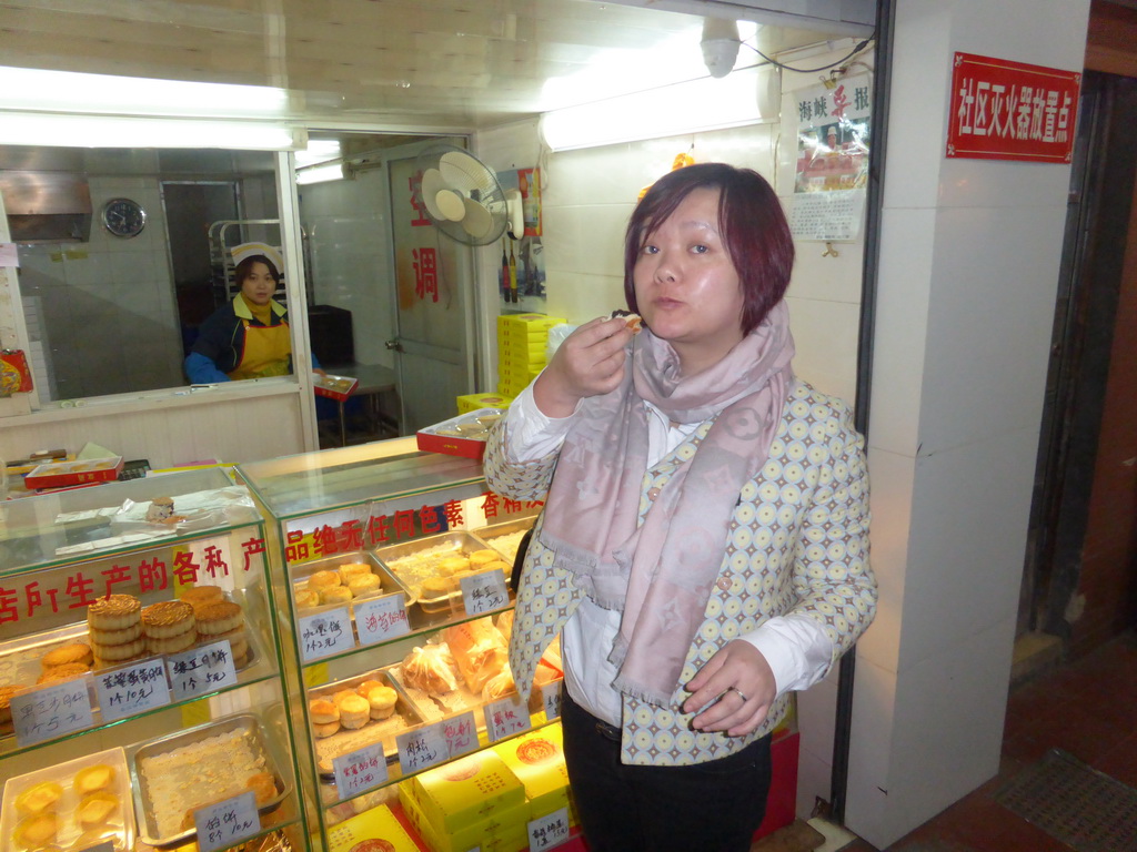 Miaomiao in front of a confectionery at Kaiyuan Road