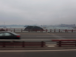 The Datu Islet in the Xiamen Bay and skyscrapers at the Haicang district, viewed from the bus to Yongding on the Haicang Bridge