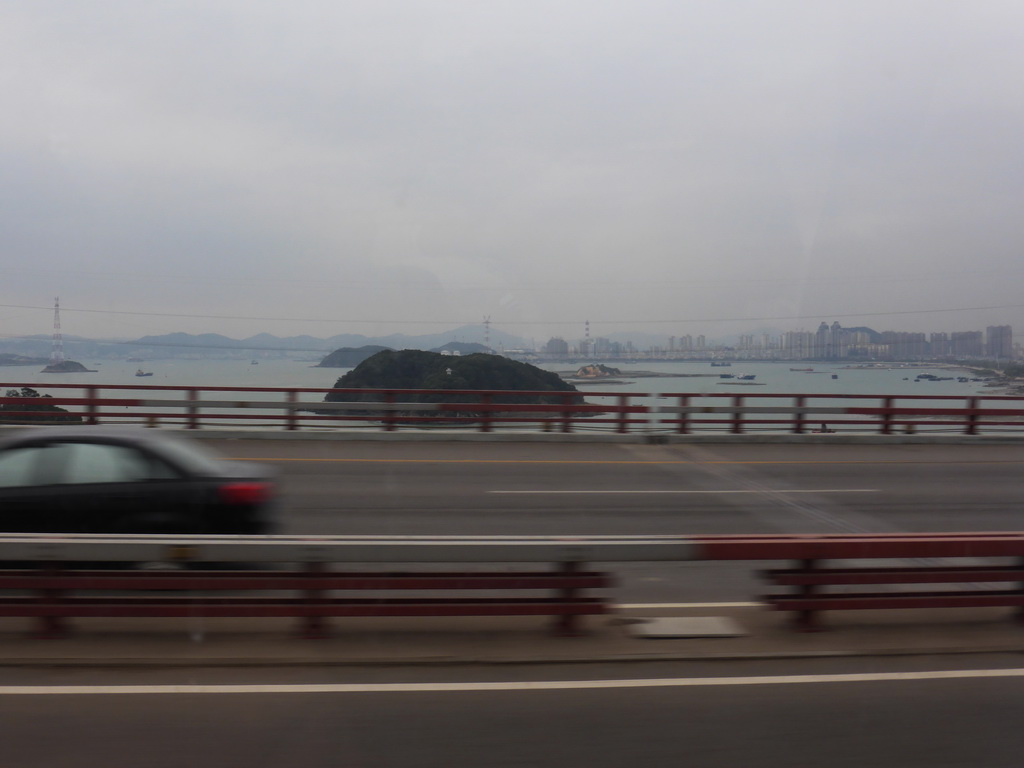 The Datu Islet in the Xiamen Bay and skyscrapers at the Haicang district, viewed from the bus to Yongding on the Haicang Bridge