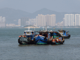 Boats in Xiamen Bay, Dayu Island and buildings at the Haicang district, viewed from the ferry to Gulangyu Island